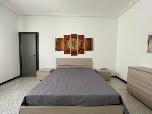 Säng eller sängar i ett rum på Vincenti's House Comiso