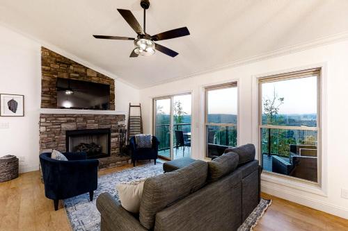 a living room with a couch and a fireplace at Panoramic View in Maynardville