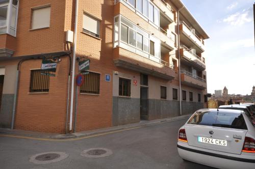 a car parked on the side of a street at Hostal El Bugar in Teruel