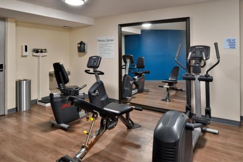 a gym with treadmills and exercise bikes in a room at Holiday Inn Express Winston-Salem Medical Ctr Area in Winston-Salem