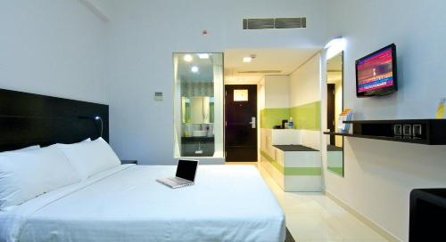 Tempat tidur dalam kamar di Keys Select by Lemon Tree Hotels, Thiruvananthapuram