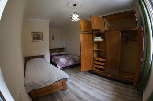 a small bedroom with a bed and a closet at Dream Land Batumi in Batumi