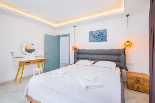 Postel nebo postele na pokoji v ubytování Nergis Apart