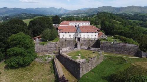 an aerial view of an old castle in a field at Maison au coeur de la rue pietonne in Saint-Jean-Pied-de-Port