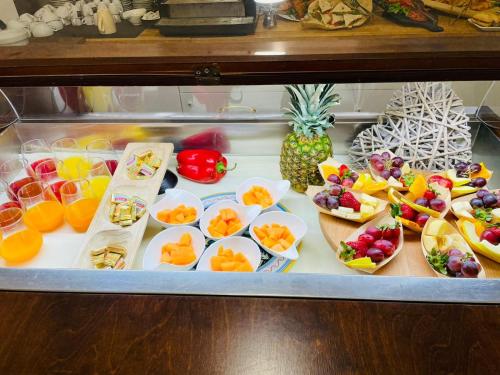 a display of fruits and vegetables in a refrigerator at Hotel Okinawa in Rimini