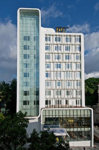 a large white building with a lot of windows at Keys Select by Lemon Tree Hotels, Thiruvananthapuram in Trivandrum