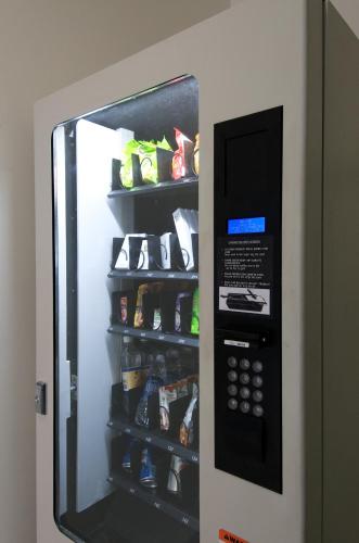 a refrigerator filled with lots of food and drinks at Keys Select by Lemon Tree Hotels, Thiruvananthapuram in Trivandrum