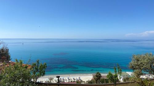 a view of a beach and the ocean at Caia Appartamenti Tropea in Tropea