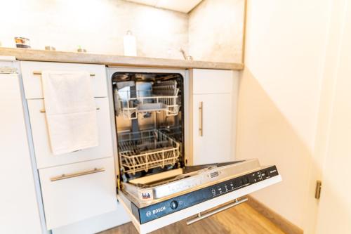Kuchyň nebo kuchyňský kout v ubytování TAGBLATT 2-Zimmer-Apartment