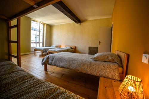 a bedroom with two beds in a room at Amañi Hostel in La Réole