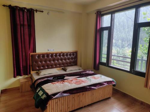 Postel nebo postele na pokoji v ubytování Malang Kasol