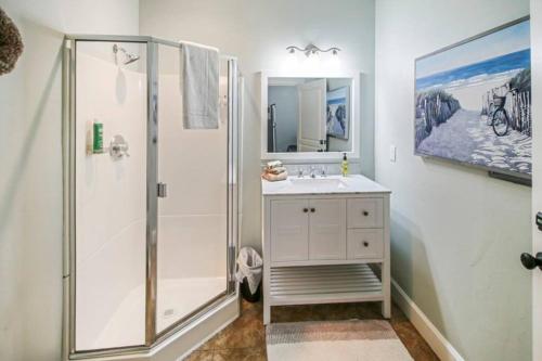 a bathroom with a shower and a sink at Parkside Cottage in Jacksonville
