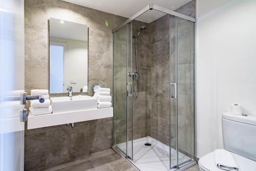 a bathroom with a shower and a sink at INF45P- modern 3 bed city apartment next to beach in Estepona
