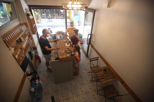 people standing around a kitchen table at Kinzi House in Canakkale