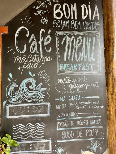 Et logo, certifikat, skilt eller en pris der bliver vist frem på Suítes Aracuã