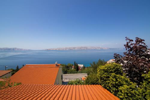 a view of the water from the roof of a house at Apartment Žuna in Senj