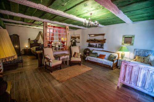 a living room with a couch and a table at Šumski Dvori Apartment in Ogulin