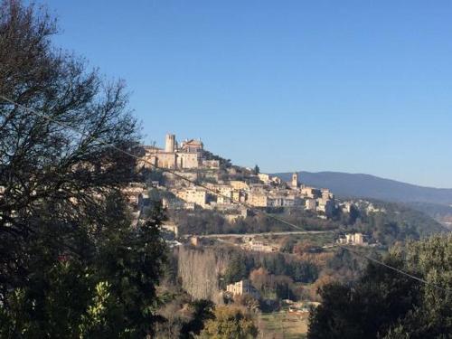 a castle on top of a hill with trees at CASA VACANZA LA VILLA in Amelia