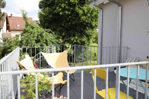 a balcony with two chairs and a pool at Pegnitz Apartement in Pegnitz