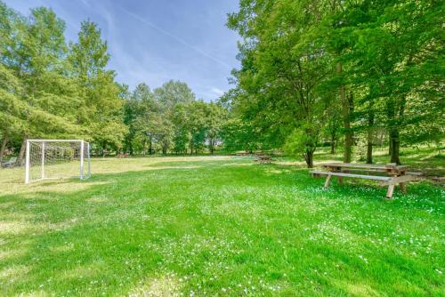 a park with a bench and a soccer goal at Oasi Borghetto Verde in Castellaro