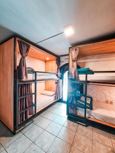 a room with two bunk beds and a window at MedioMundo Hostel in Montevideo