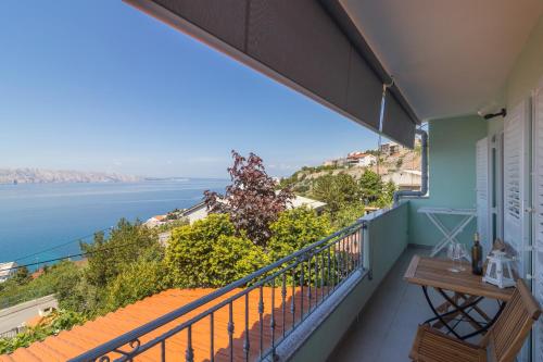 a balcony with a view of the ocean at Apartment Žuna in Senj