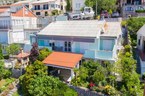 an aerial view of a blue house with an orange roof at Apartment Žuna in Senj