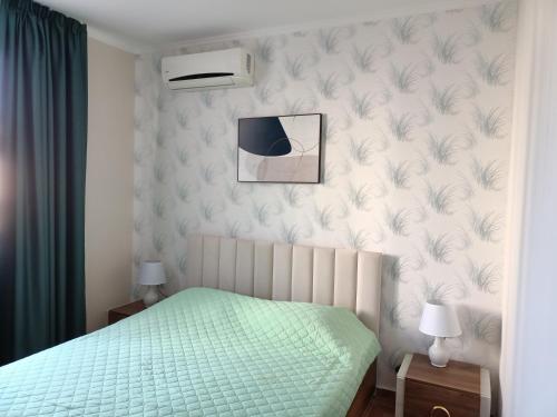 A bed or beds in a room at Sun Wave EXCLUSIVE