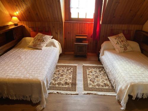a bedroom with two beds and a window at Appartement Erdeven, 3 pièces, 4 personnes - FR-1-397-47 in Erdeven