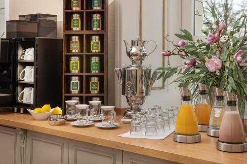 a kitchen counter with a trophy and glasses on it at Schloss Rattey in Schönbeck