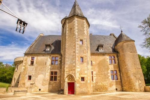 an old stone building with a tower at Château de Vieux Moulin in Vielmanay