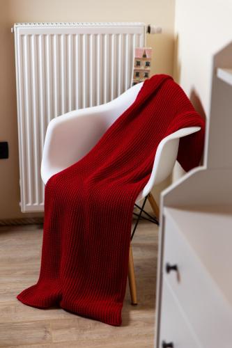 a red blanket on a white chair in a room at Mountain house Beauty of Laz in Ravna Gora