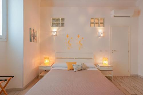Posteľ alebo postele v izbe v ubytovaní Approdo Rooms - Eja Sardinia