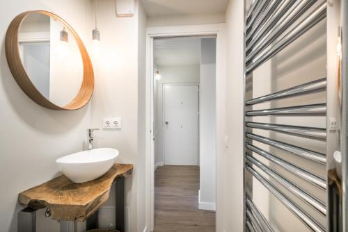 a bathroom with a sink and a mirror at LUA in Vielha