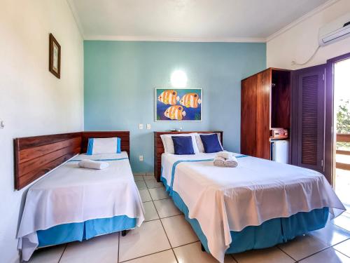 Cama o camas de una habitación en Pousada Cachadaço
