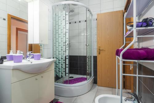 a bathroom with a shower and a sink at Apartment Belma Poreč in Radmani