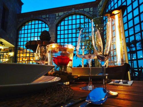 a table with wine glasses on top of a table at Hacienda San Patricio in San Miguel de Allende