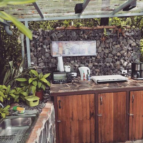 a outdoor kitchen with a counter with a sink at Domos Mirador Romantic Private Honeymoon Glamping in Miramar