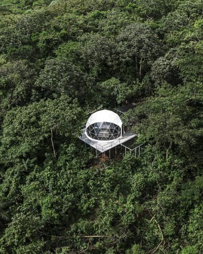 an aerial view of a tent in the middle of a forest at Domos Mirador Romantic Private Honeymoon Glamping in Miramar