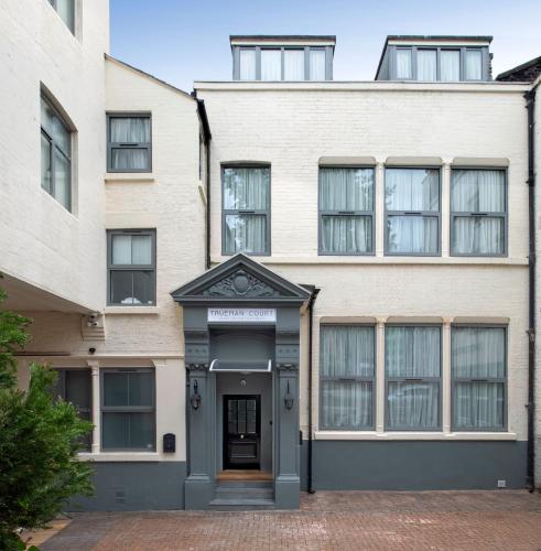 an exterior view of a building with a door at Trueman Court Luxury Serviced Apartments in Liverpool