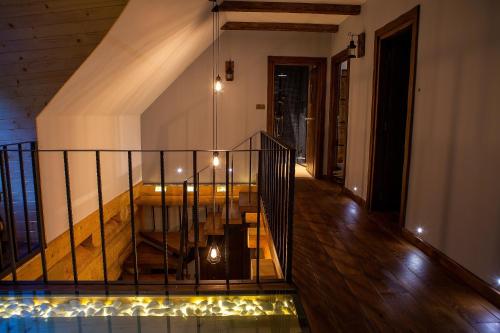 a staircase in a house with lights on it at SASKI ZAKĄTEK, WAKACJE W BAJKOWYM DOMKU!!! MAZURY, SAUNA, JEZiORO, POMOST, in Sasek Mały