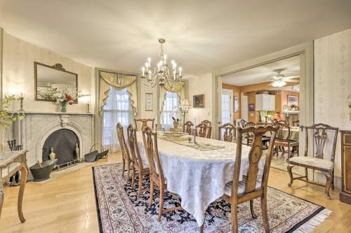 a dining room with a table and a fireplace at Elegant Norwich House with Billiards Room and Ballroom in Norwich