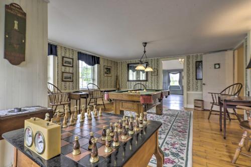 a living room with a table with a chess board at Elegant Norwich House with Billiards Room and Ballroom in Norwich
