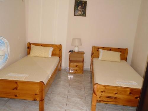 Кровать или кровати в номере Giota & Antonia Apartments