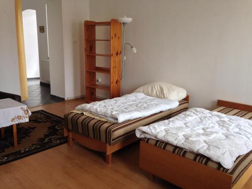 Posteľ alebo postele v izbe v ubytovaní Petra Apartmanok
