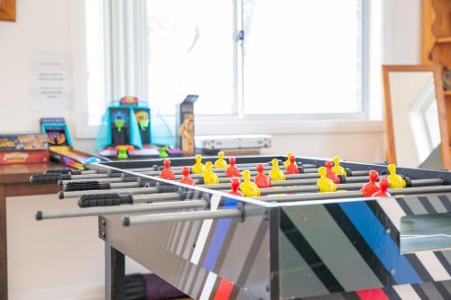 a ping pong table with toy figures on it at The roses house - Cozy and Modern house in Katoomba in Katoomba