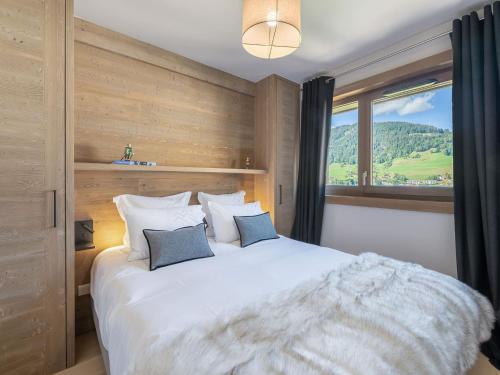 Katil atau katil-katil dalam bilik di Luxueux appartement 3 chambres à Megève avec piscine et salle de sport - FR-1-569-31