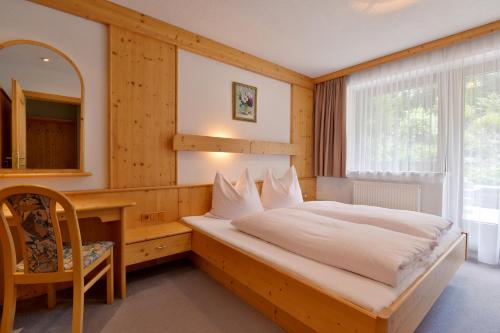 Кровать или кровати в номере Landhaus zum Griena