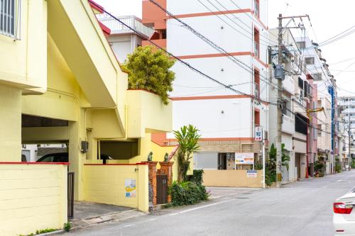 an empty street in a city with buildings at M`Sリゾート若狭@LiB PLUS in Tomari