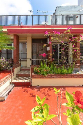 a house with flowers and plants in front of it at M`Sリゾート若狭@LiB PLUS in Tomari